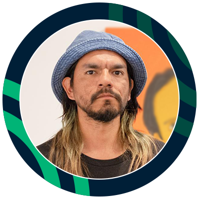 Young male student with a bear wearing a hat