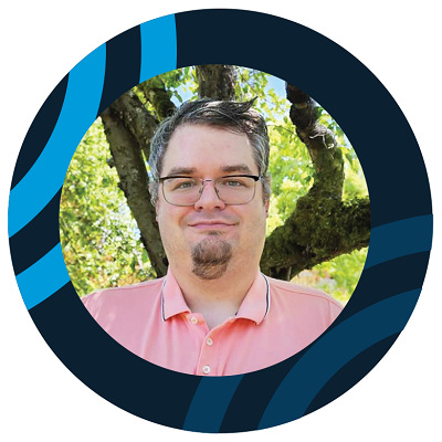 Smiling young man with glasses and a goatee