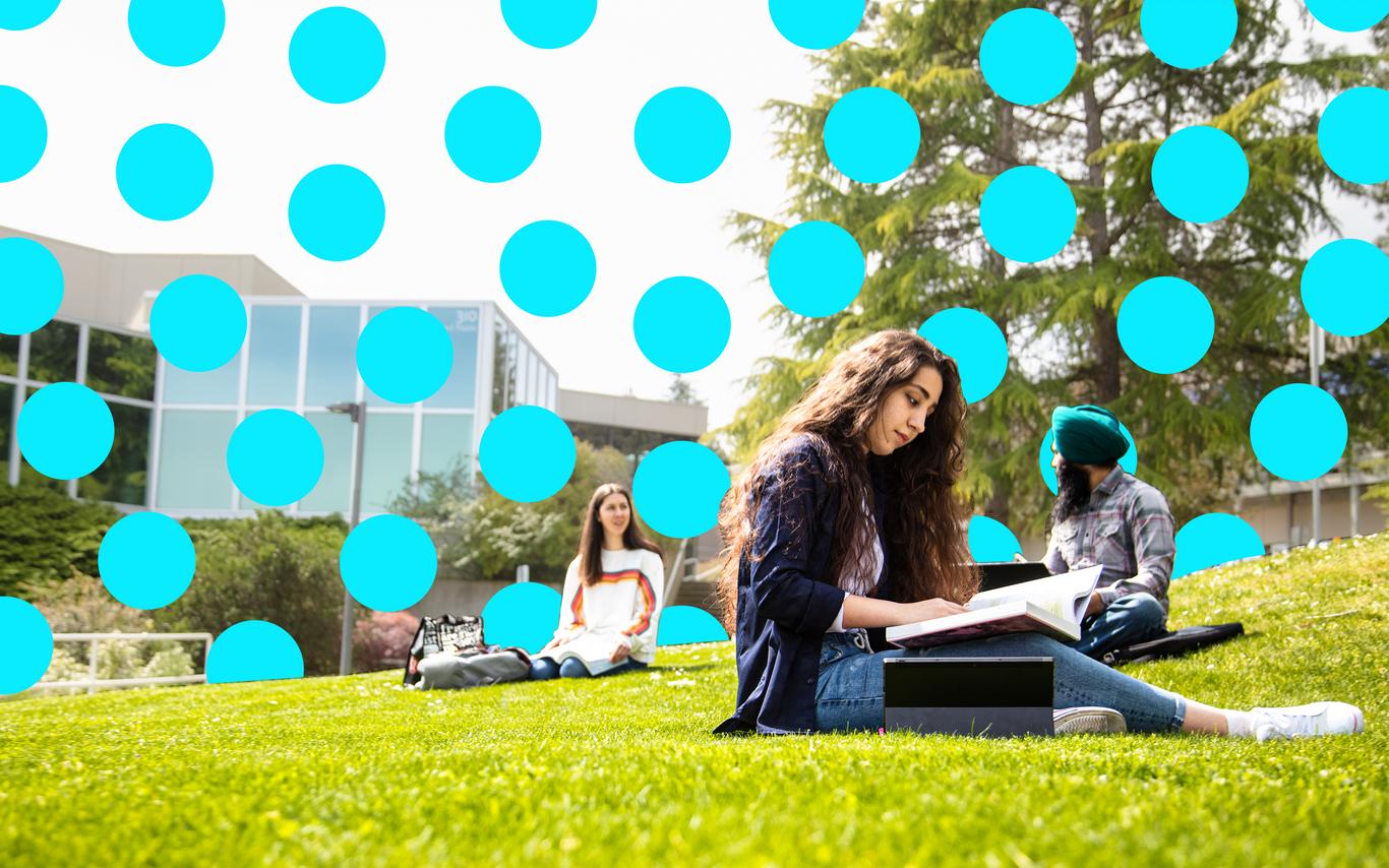 Youn woman working on a laptop outdoors