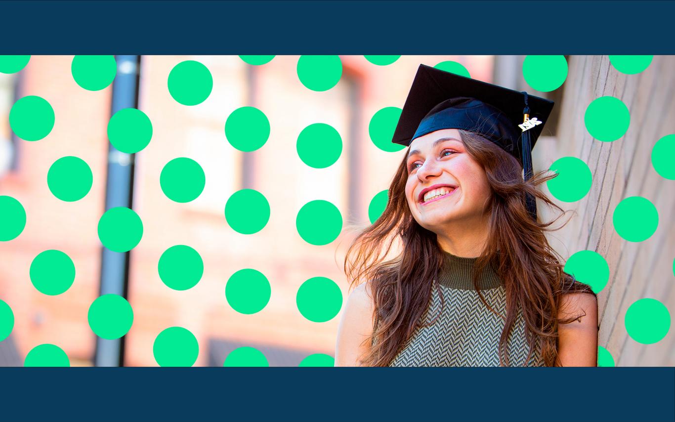 Smiling young woman wearing a graduation cap