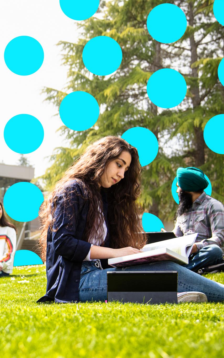 Youn woman working on a laptop outdoors
